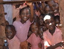 school children looking through classroom window in Kenya