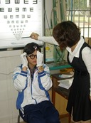 Chinese girl having eyes tested