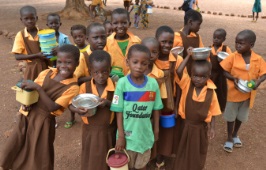 Ghanaian children with lunchboxes.jpg