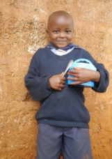 Boy with school lunch in Kenya