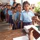 Schoolchildren in India receive deworming treatment. 