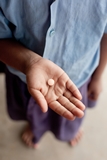 Deworming pill in child's hand