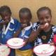 Girls in Nigeria eating lunch in school 