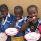 Girls eating in a Nigerian school