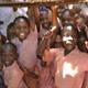 Kenyan schoolchildren looking through classroom window
