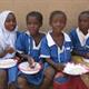 Girls eating in Nigeria