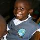 Boy in Kenyan classroom on a deworming day